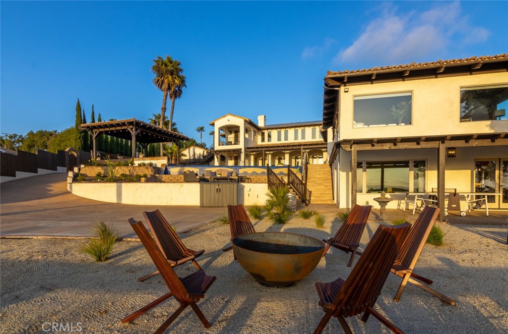 4567 Sleeping Indian Road Fallbrook, CA 92028 - Photo 33 of 72 a view of a patio with chairs and potted plants