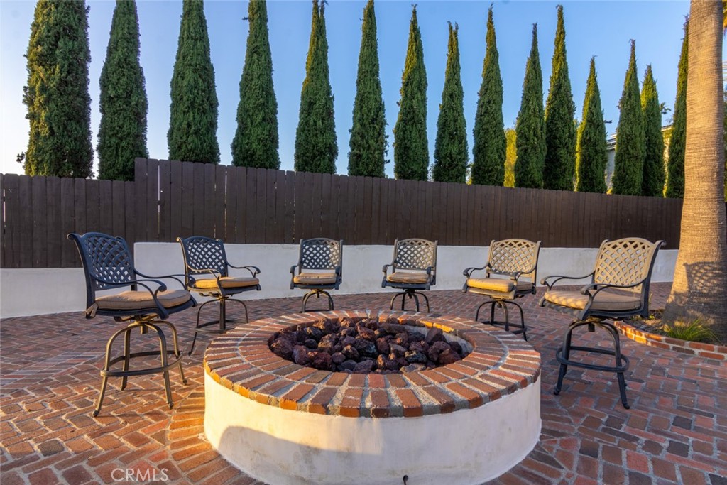 4567 Sleeping Indian Road Fallbrook, CA 92028 - Photo 34 of 72 a outdoor space with chairs and a fire pit