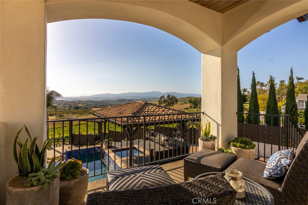 4567 Sleeping Indian Road Fallbrook, CA 92028 - Photo 39 of 72 a view of a balcony with couches and wooden floor