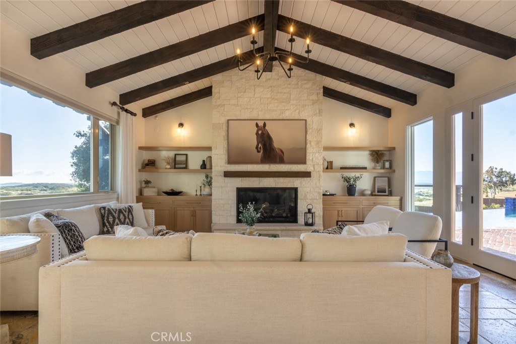 4567 Sleeping Indian Road Fallbrook, CA 92028 - Photo 45 of 72 a living room with furniture and a fireplace