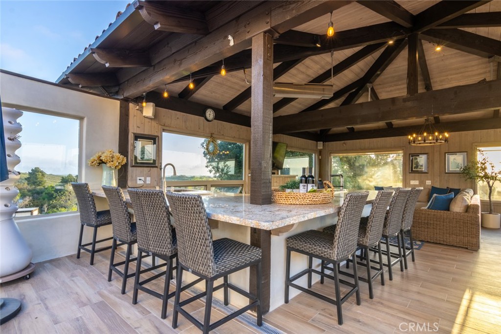 4567 Sleeping Indian Road Fallbrook, CA 92028 - Photo 52 of 72 a view of a dining room with furniture window and wooden floor