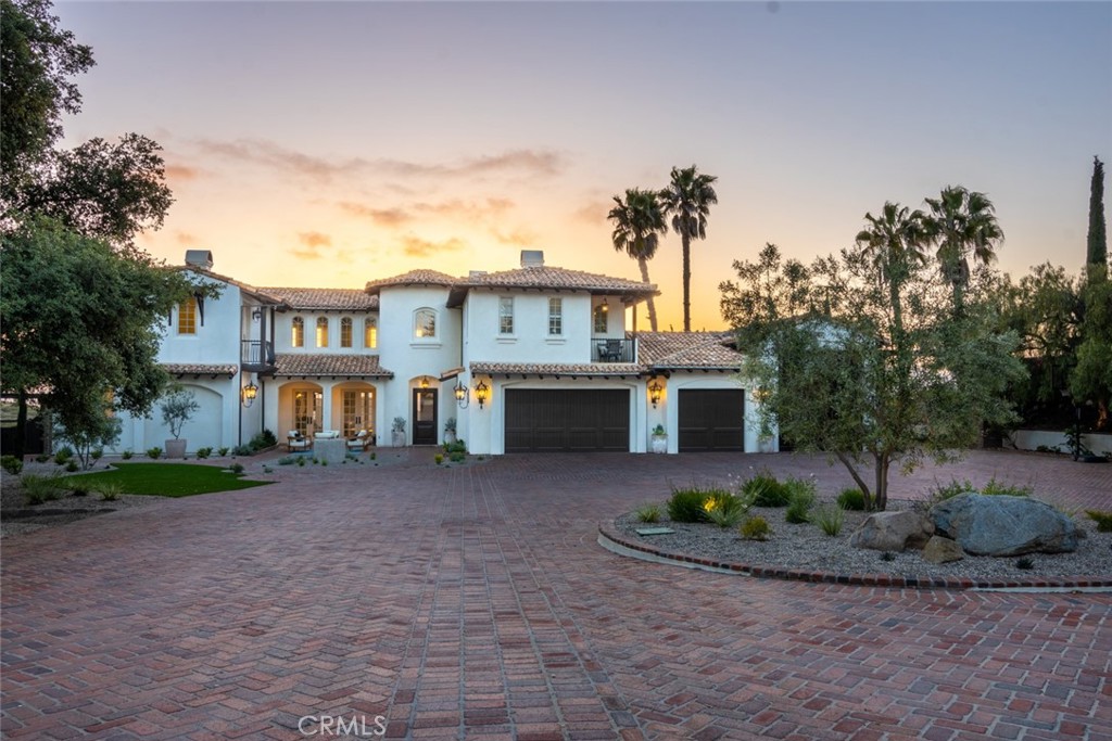 4567 Sleeping Indian Road Fallbrook, CA 92028 - Photo 57 of 72 a front view of a house with a yard and potted plants