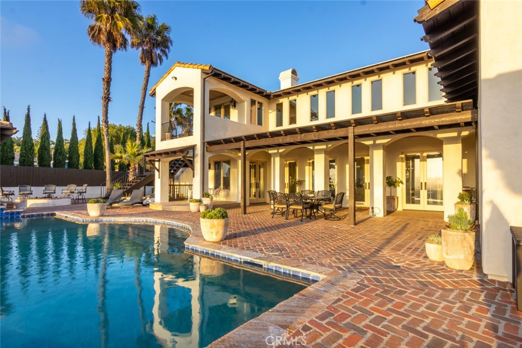 4567 Sleeping Indian Road Fallbrook, CA 92028 - Photo 60 of 72 a front view of a house with swimming pool having outdoor seating
