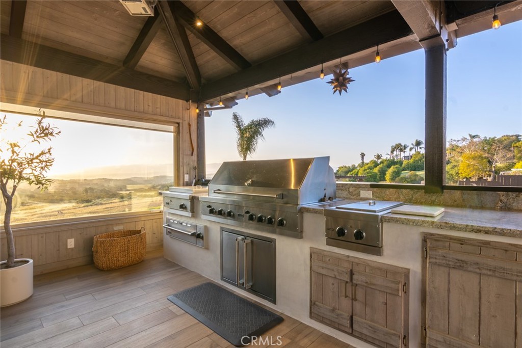 4567 Sleeping Indian Road Fallbrook, CA 92028 - Photo 62 of 72 a kitchen with a stove a sink and a refrigerator