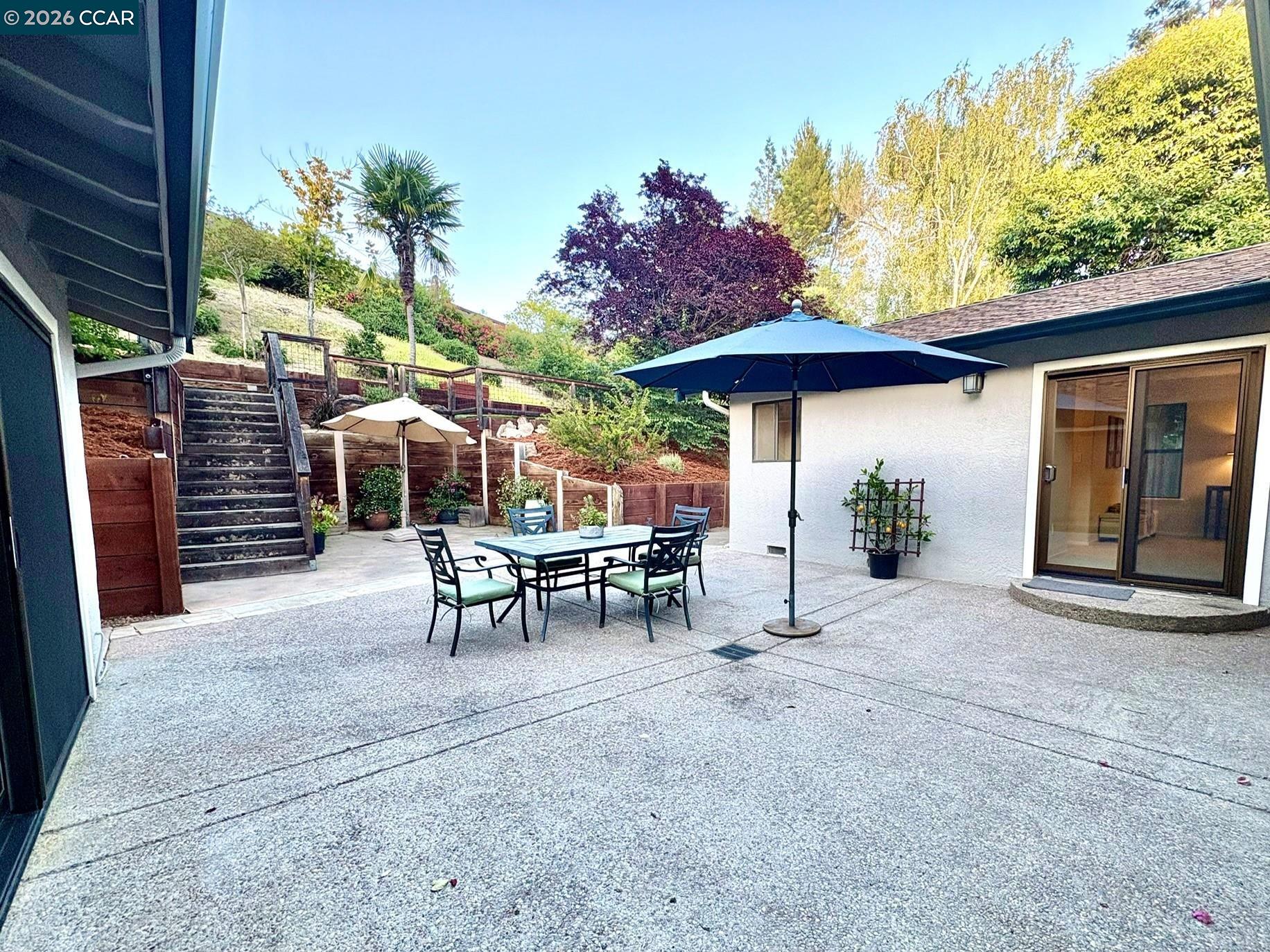 2589 Pebble Beach Loop Lafayette, CA 94549 - Photo 25 of 32 a view of a chairs and table in backyard
