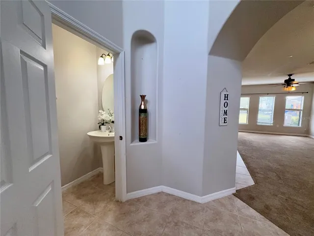 a bathroom with a sink a mirror and shower