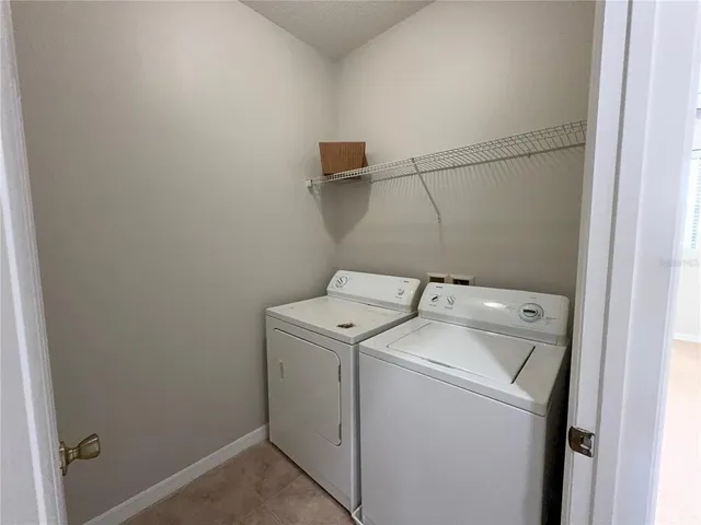 an empty room with closet and a ceiling fan