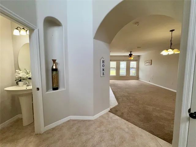 a view of entryway and hallway with a front door