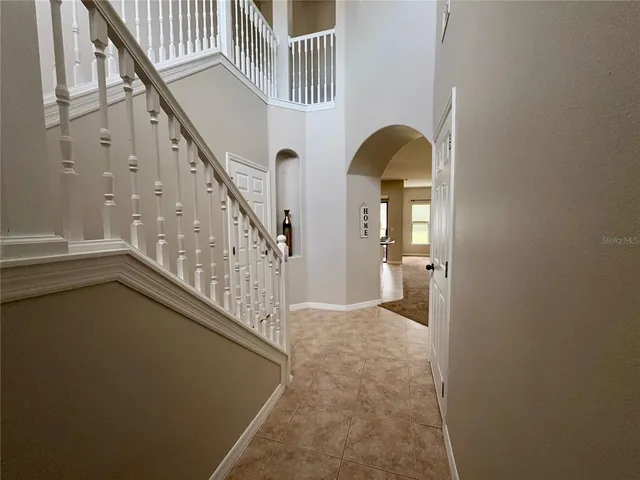 a view of a kitchen with a sink and a ceiling fan
