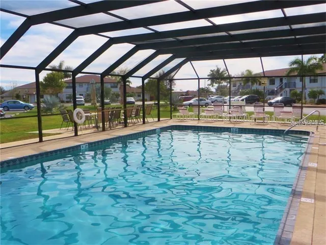 a view of a swimming pool with a porch