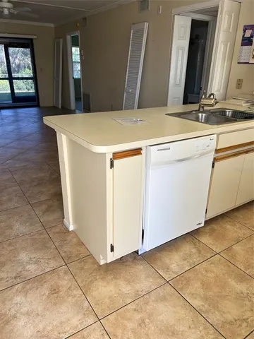 a room with a sink and cabinets