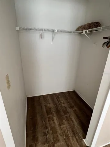 a view of a room with racks on the wall