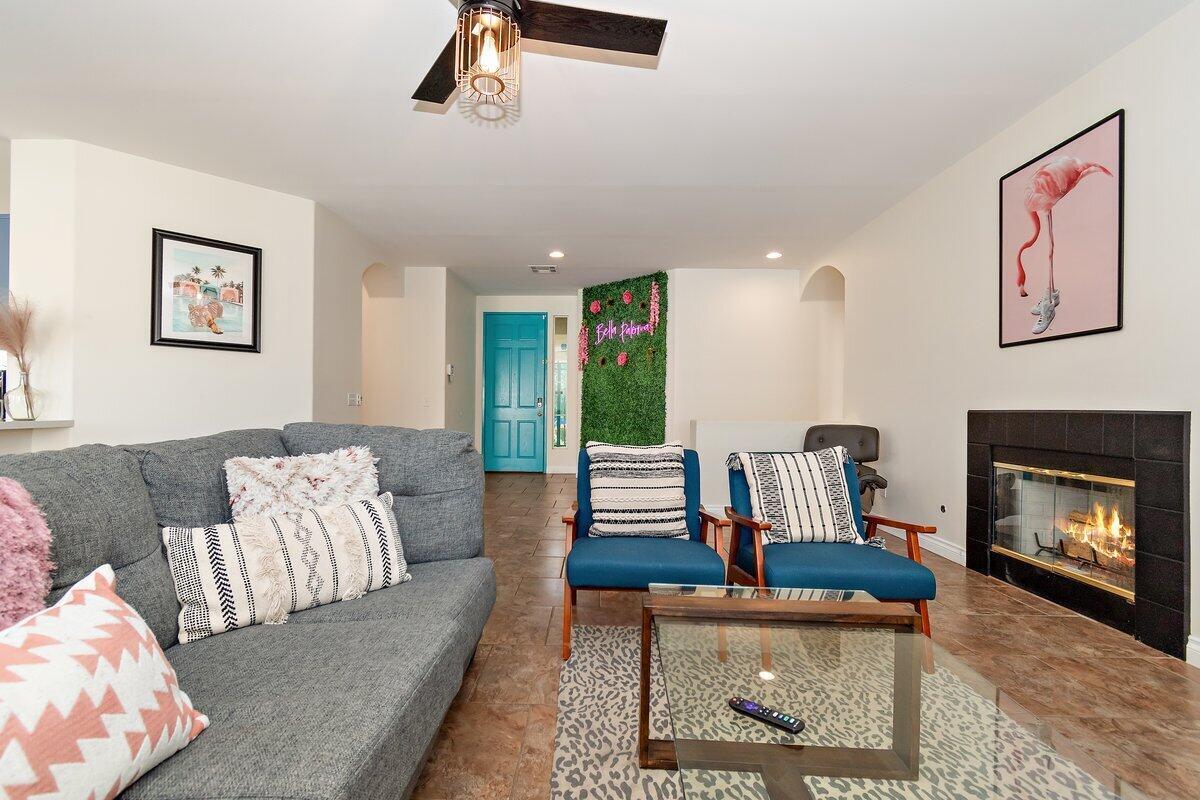 80746 Diamondback Trail Indio, CA 92201 - Photo 11 of 21 a living room with furniture and a fireplace