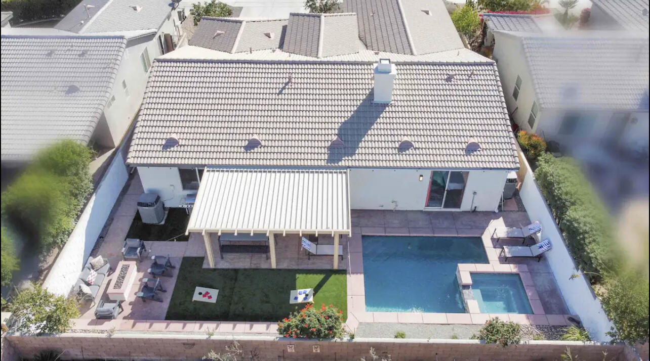 80746 Diamondback Trail Indio, CA 92201 - Photo 2 of 21 a front view of a house with a garden