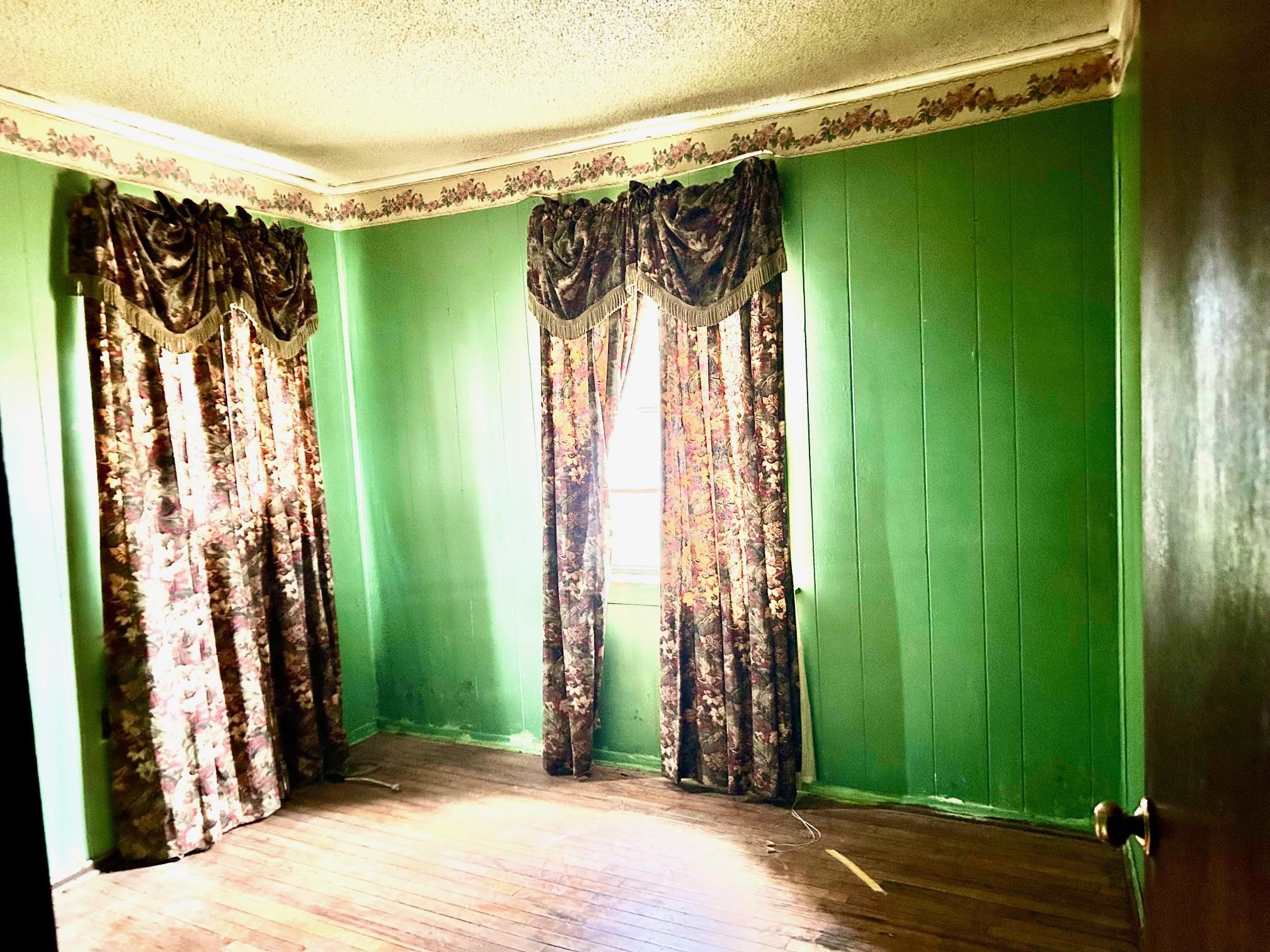 409 Hill Avenue Covington, TN 38019 - Photo 5 of 11 a view of walk in closet with green walls