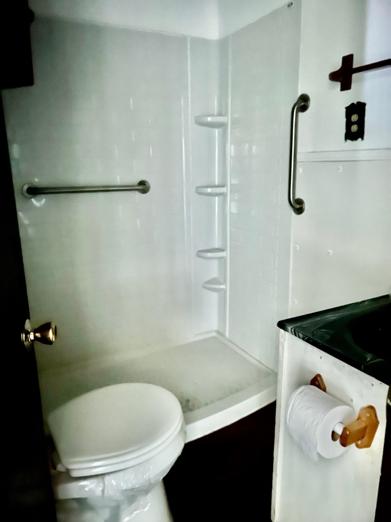 409 Hill Avenue Covington, TN 38019 - Photo 8 of 11 a bathroom with a sink and a toilet