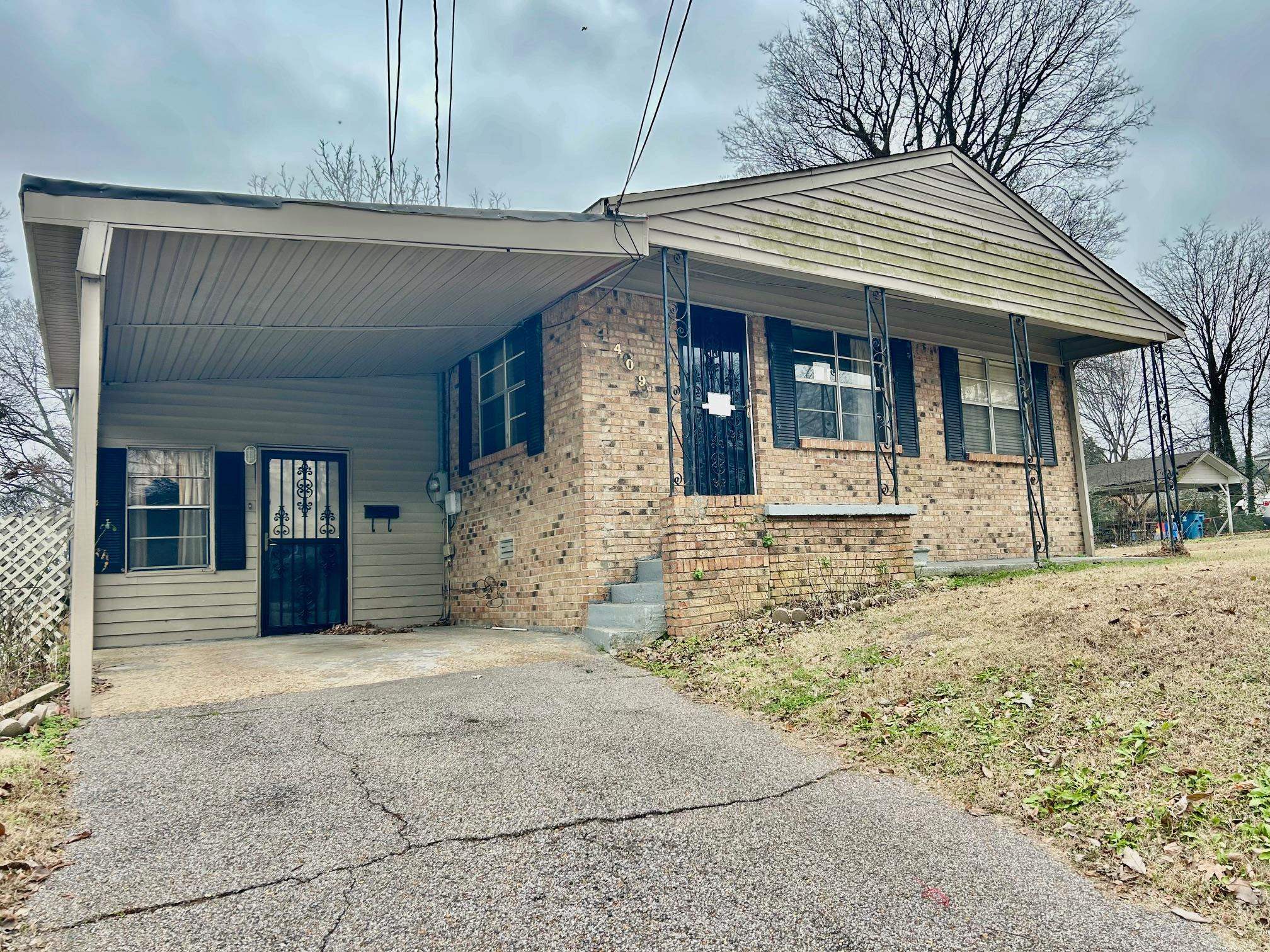 409 Hill Avenue Covington, TN 38019 - Photo 9 of 11 a front view of a house