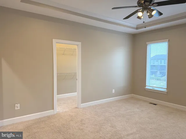 a view of an empty room with a fireplace