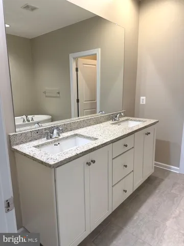 a view of hallway with wooden floor