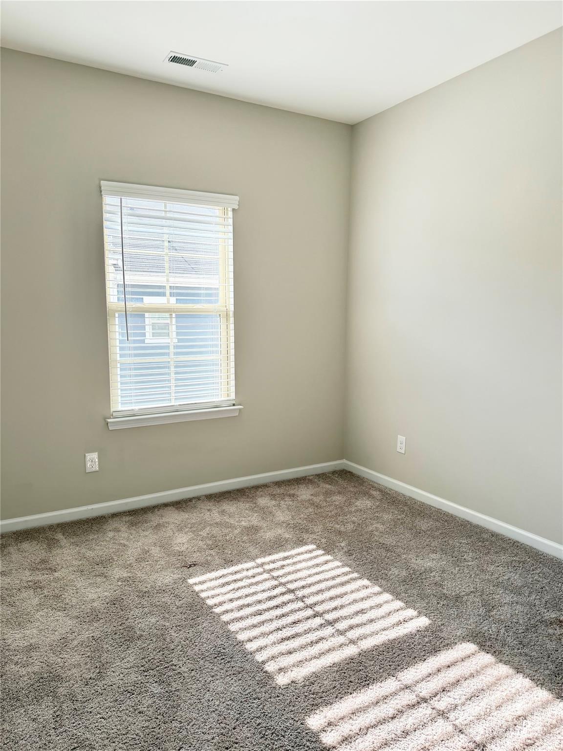 1138 Doveridge Street Charlotte, NC 28273 - Photo 20 of 22 a view of an empty room with a window