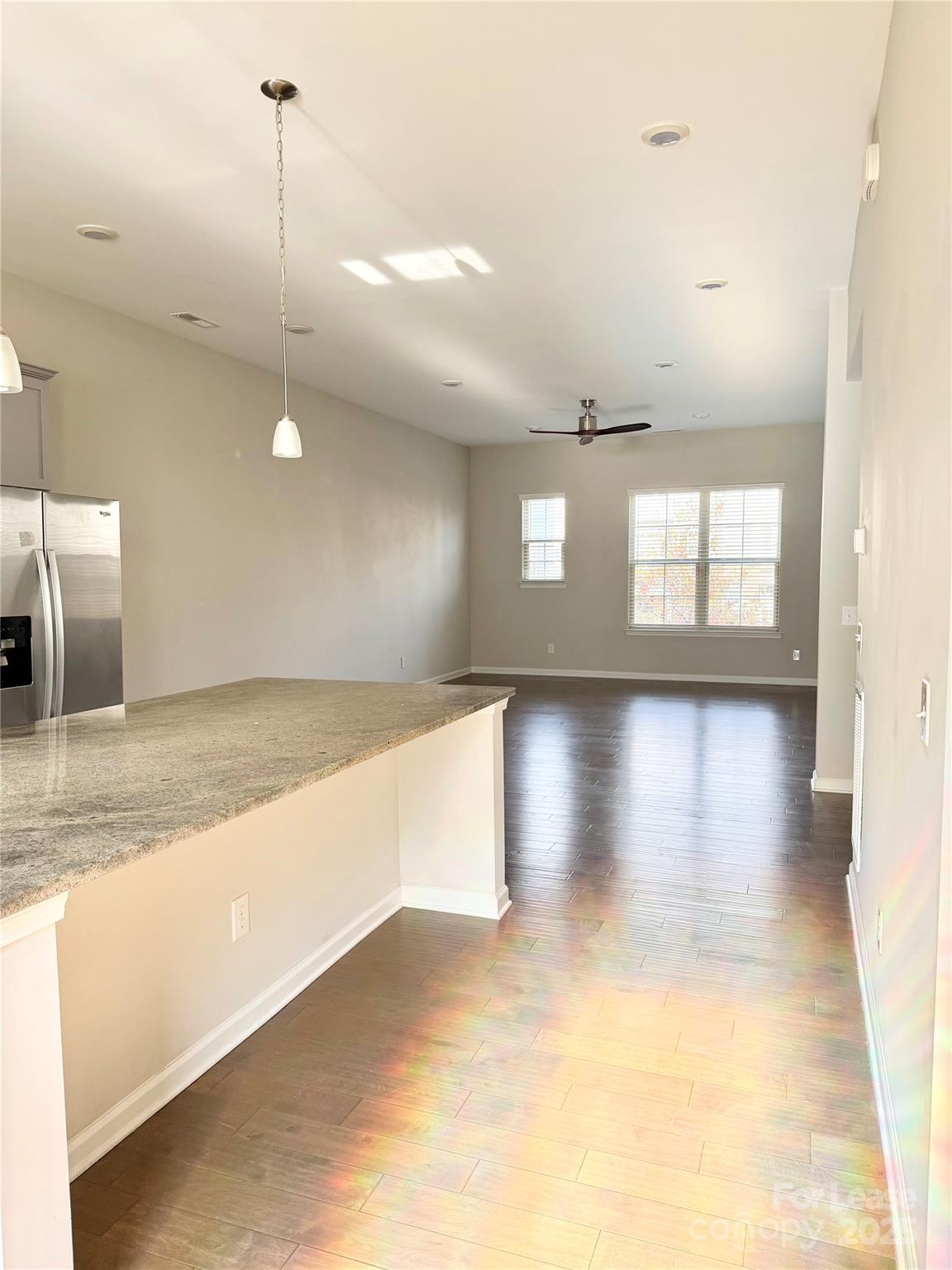 1138 Doveridge Street Charlotte, NC 28273 - Photo 5 of 22 a view of a living room with kitchen countertops and a floor to ceiling window