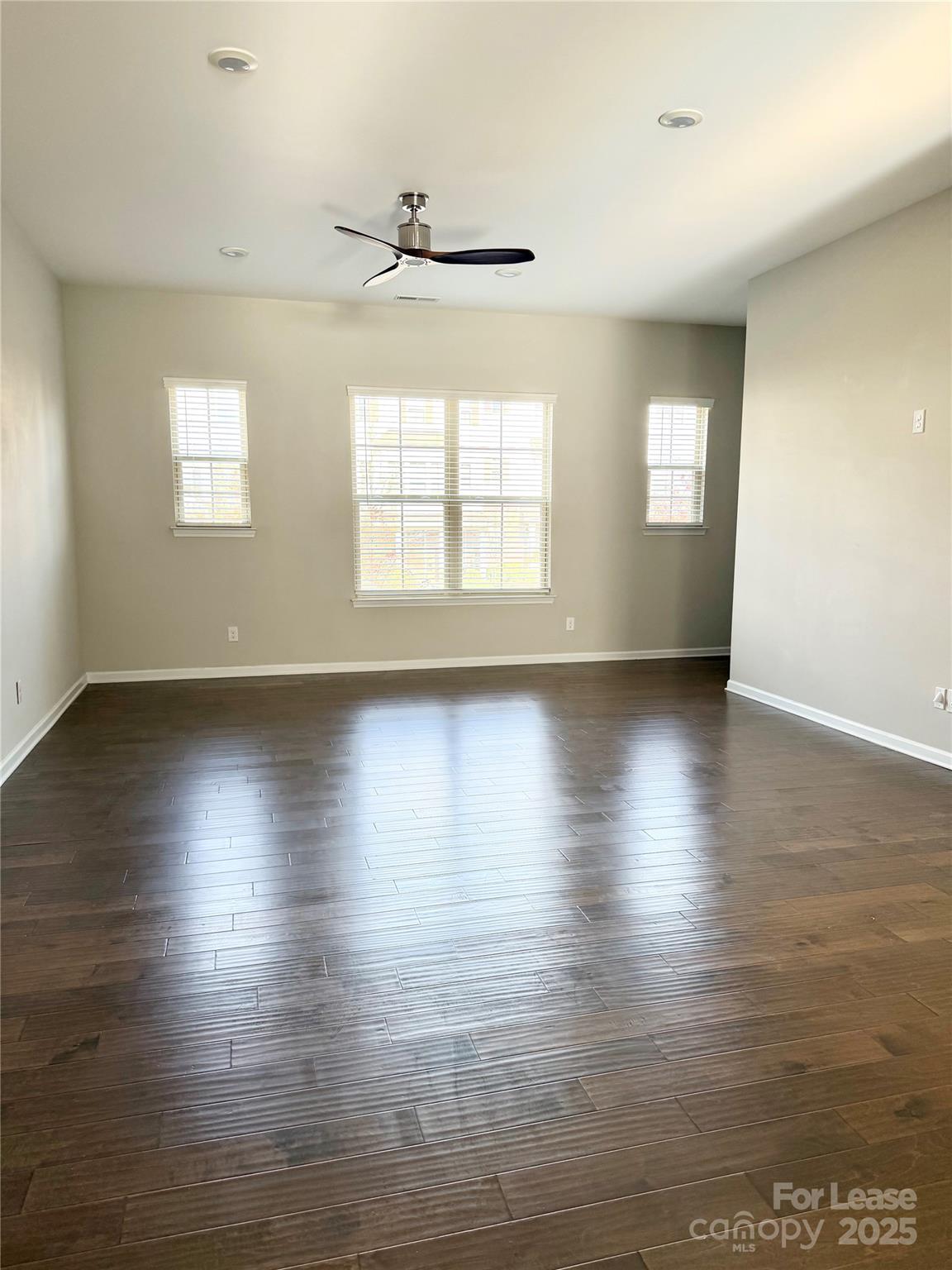 1138 Doveridge Street Charlotte, NC 28273 - Photo 8 of 22 an empty room with wooden floor and windows