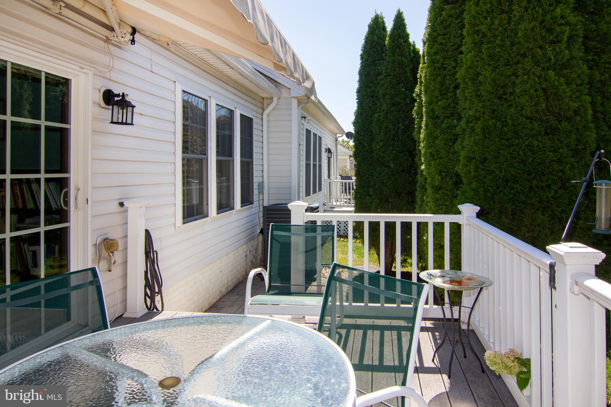 127 Ponytail Lane, Unit 133 Taneytown, MD 21787 - Photo 22 of 24 a view of a chairs and table in the balcony