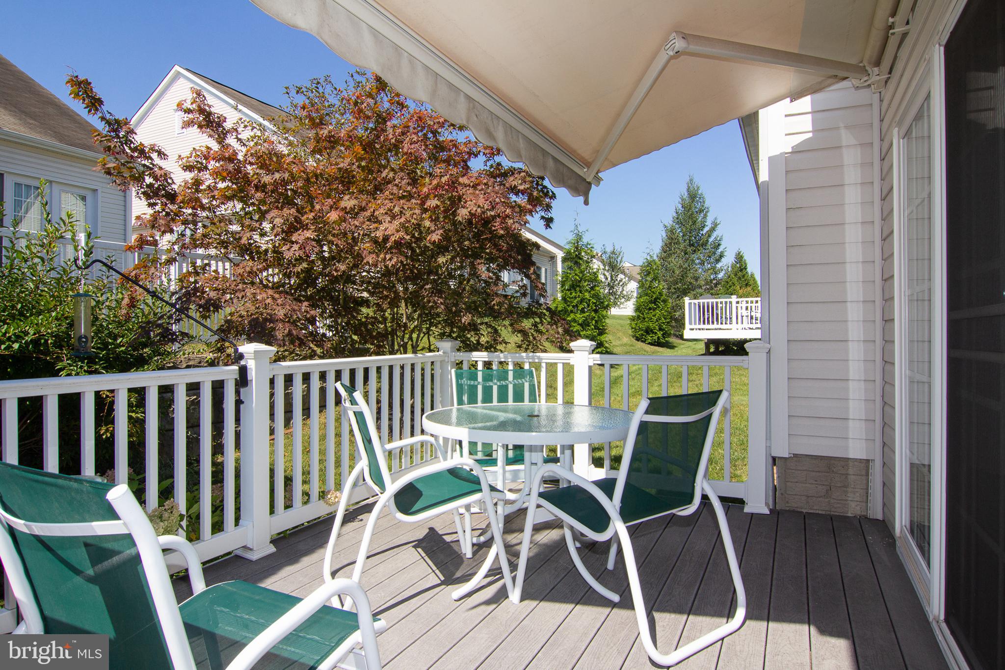 127 Ponytail Lane, Unit 133 Taneytown, MD 21787 - Photo 24 of 24 a view of a chairs and table in the balcony