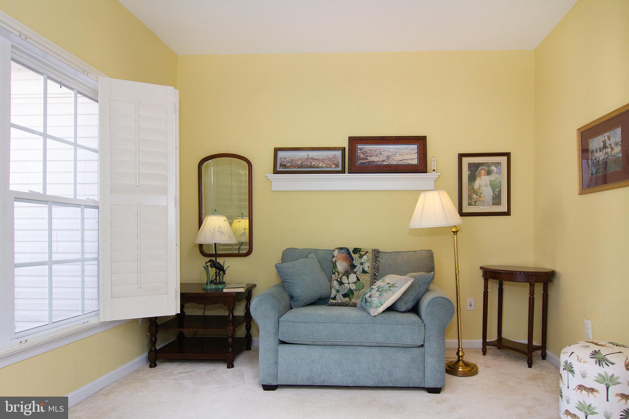 127 Ponytail Lane, Unit 133 Taneytown, MD 21787 - Photo 7 of 24 a living room with furniture and entry gate