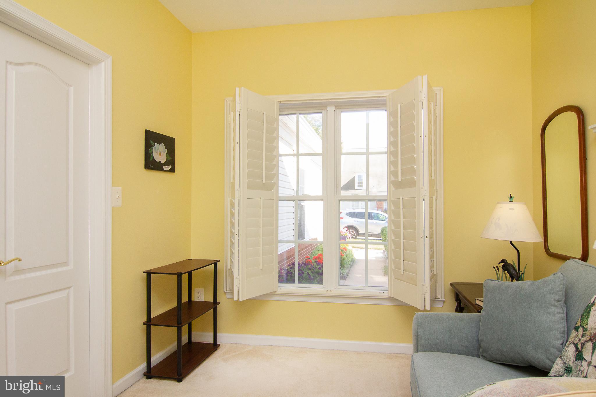127 Ponytail Lane, Unit 133 Taneytown, MD 21787 - Photo 8 of 24 a living room with furniture and a window