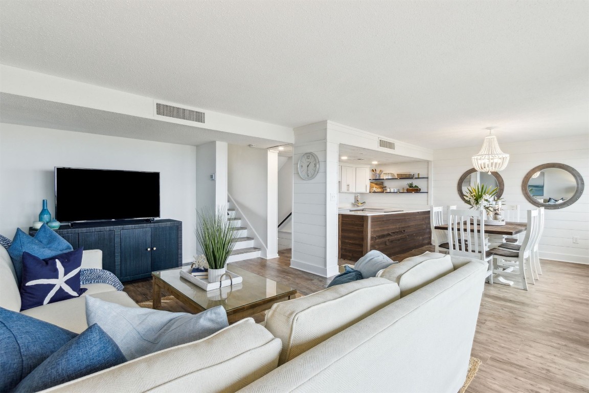 1148 Beach Walker Road, Unit 1148 Fernandina Beach, FL 32034 - Photo 9 of 80 French oak-toned plank flooring flows throughout—n