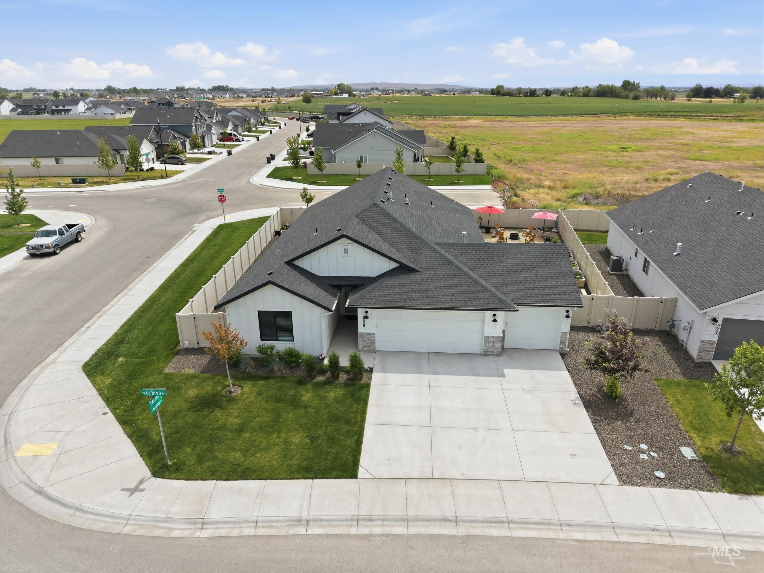 3665 W Lane Meridian, ID 83642 - Photo 41 of 42 Community swimming pool featuring a concrete deck, black metal fencing, and built-in entry steps