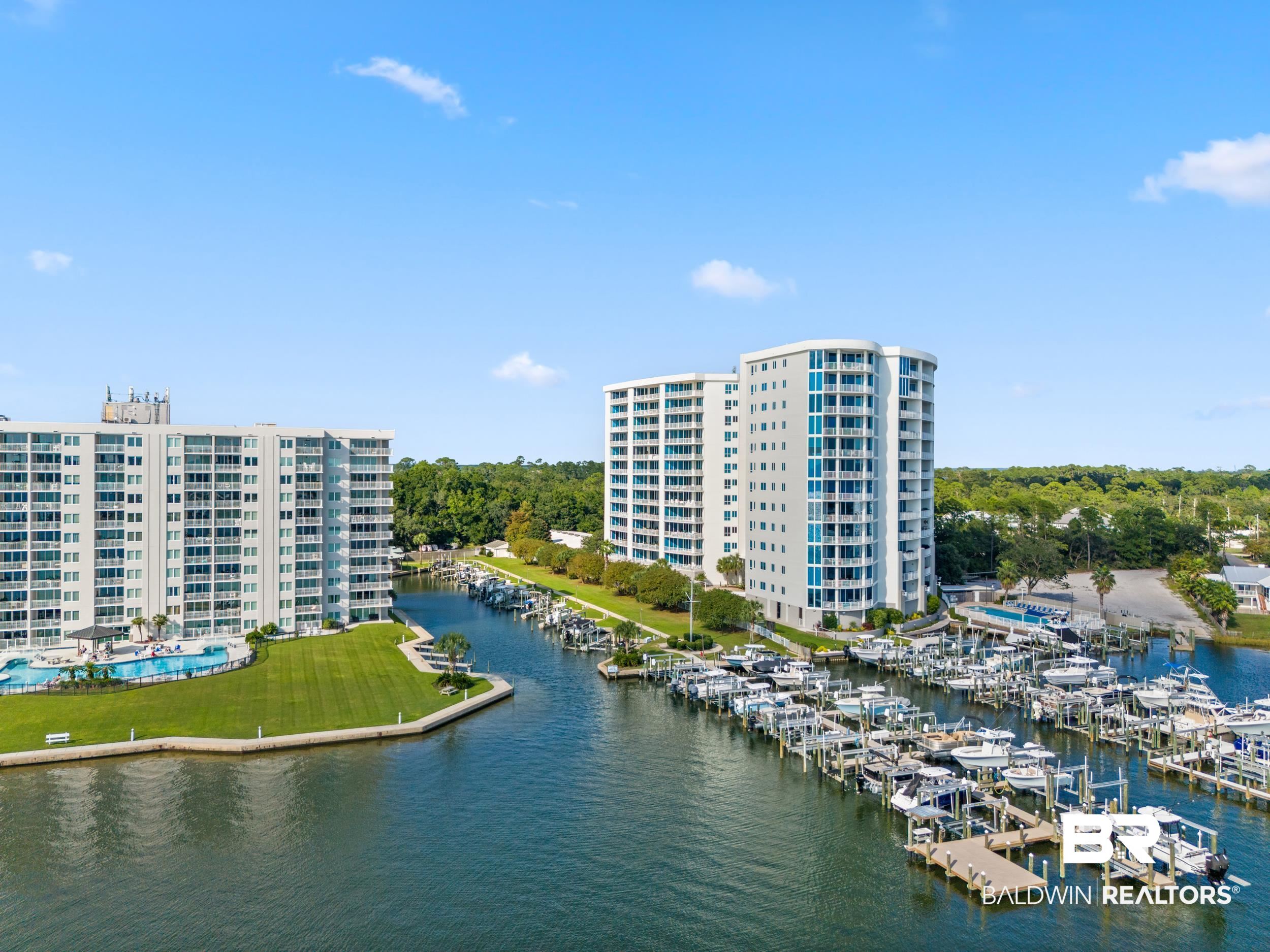 28250 Canal Road, Unit 307 Orange Beach, AL 36561 - Photo 4 of 56 Aerial view of a large body of water and a marina