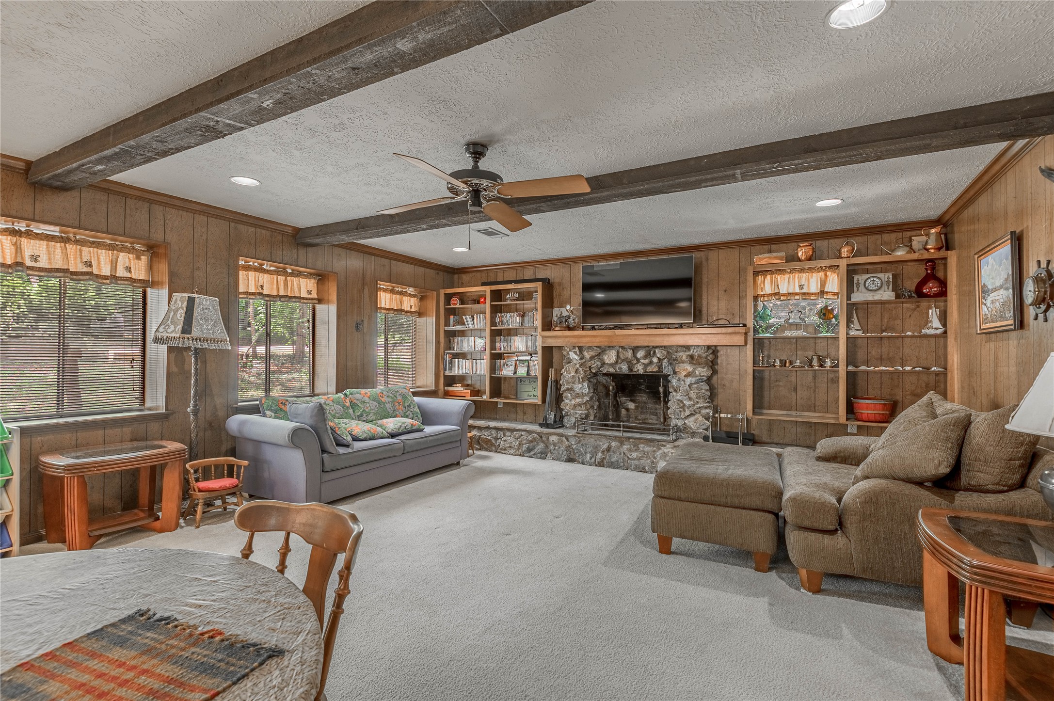 109 Hill Top Road Huntsville, TX 77320 - Photo 11 of 38 a living room with fireplace furniture and a large window