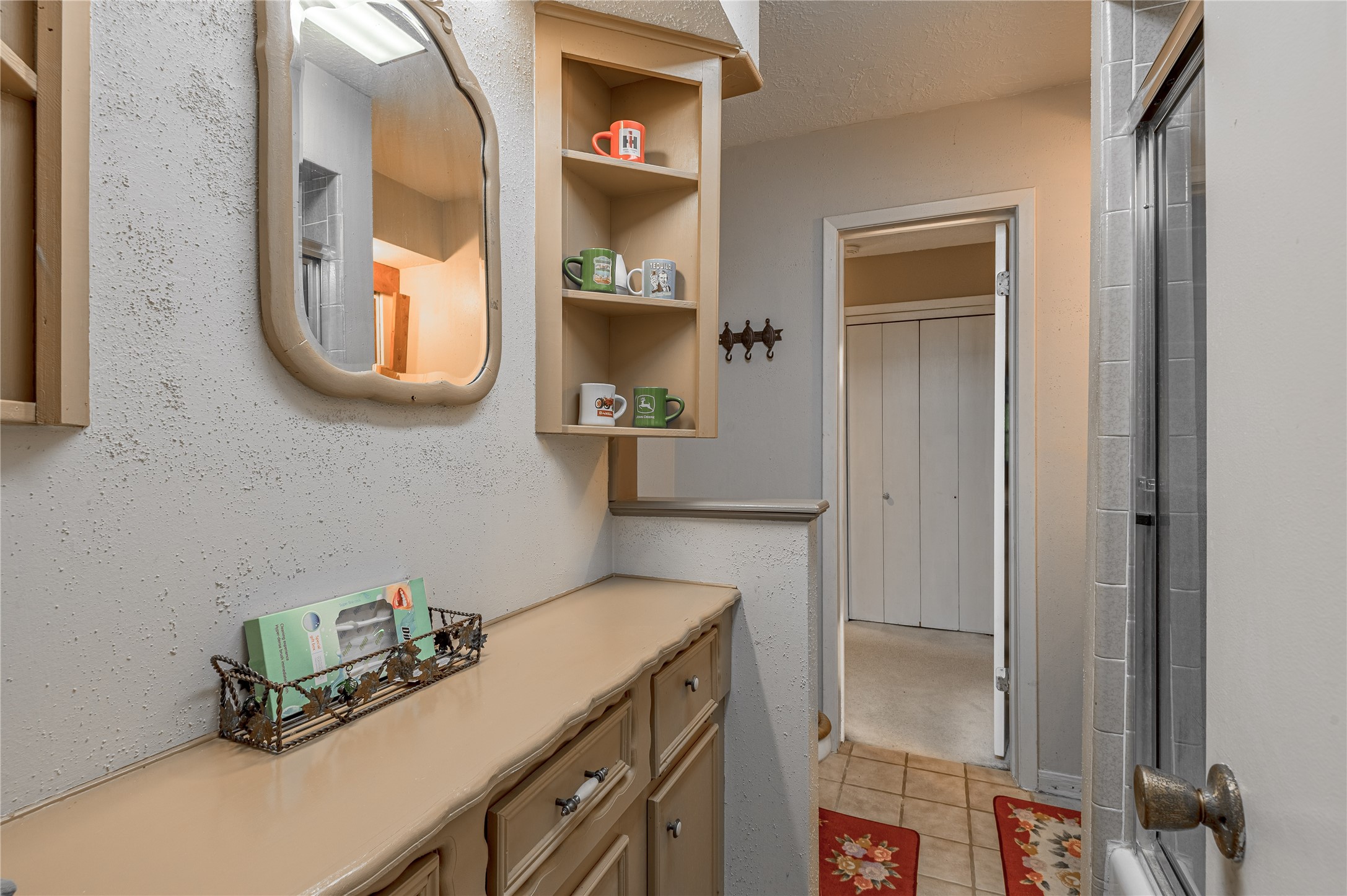 109 Hill Top Road Huntsville, TX 77320 - Photo 16 of 38 a bathroom with a sink and a mirror