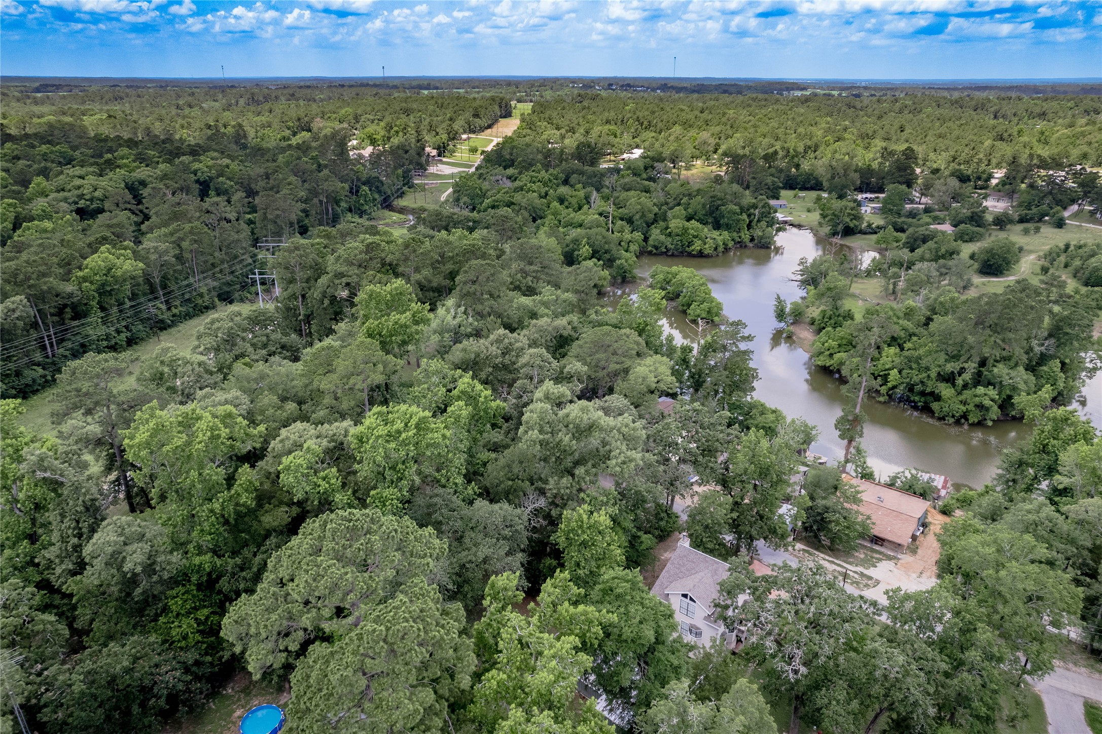 109 Hill Top Road Huntsville, TX 77320 - Photo 24 of 38 an aerial view of a house with a yard