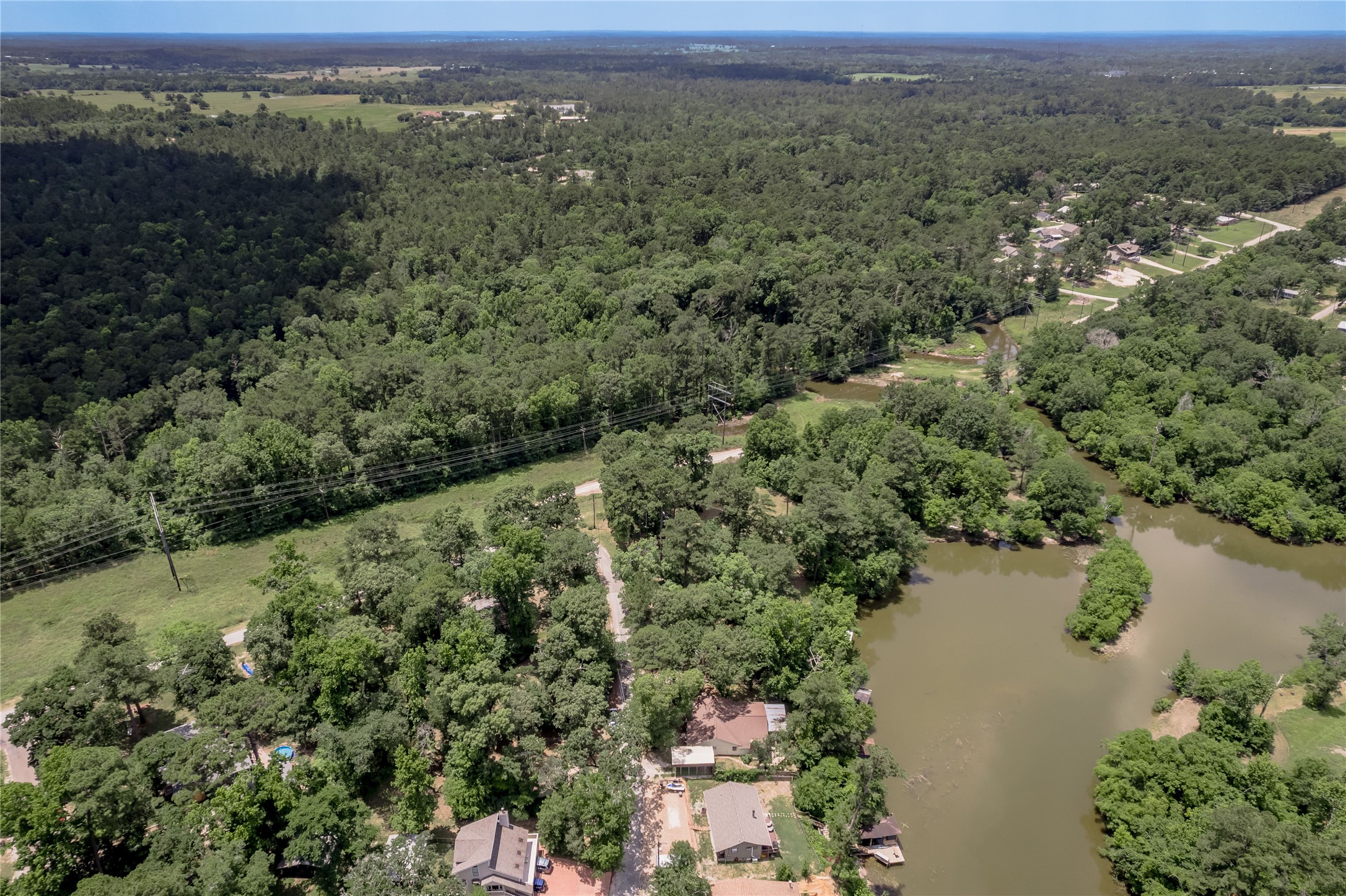 109 Hill Top Road Huntsville, TX 77320 - Photo 26 of 38 an aerial view of residential house with outdoor space and trees around