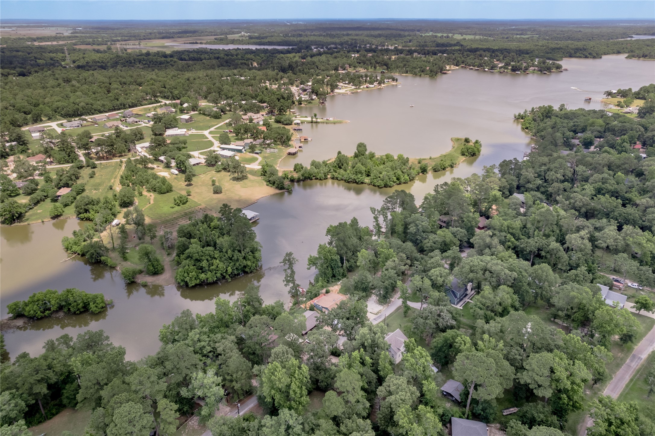 109 Hill Top Road Huntsville, TX 77320 - Photo 27 of 38 an aerial view of a houses with outdoor space and lake view