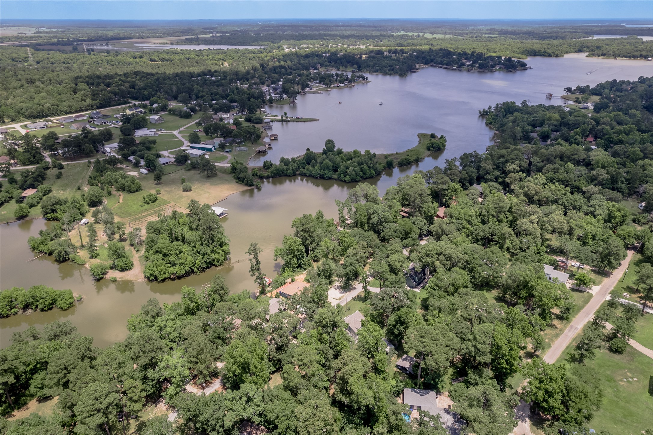 109 Hill Top Road Huntsville, TX 77320 - Photo 29 of 38 an aerial view of city and lake