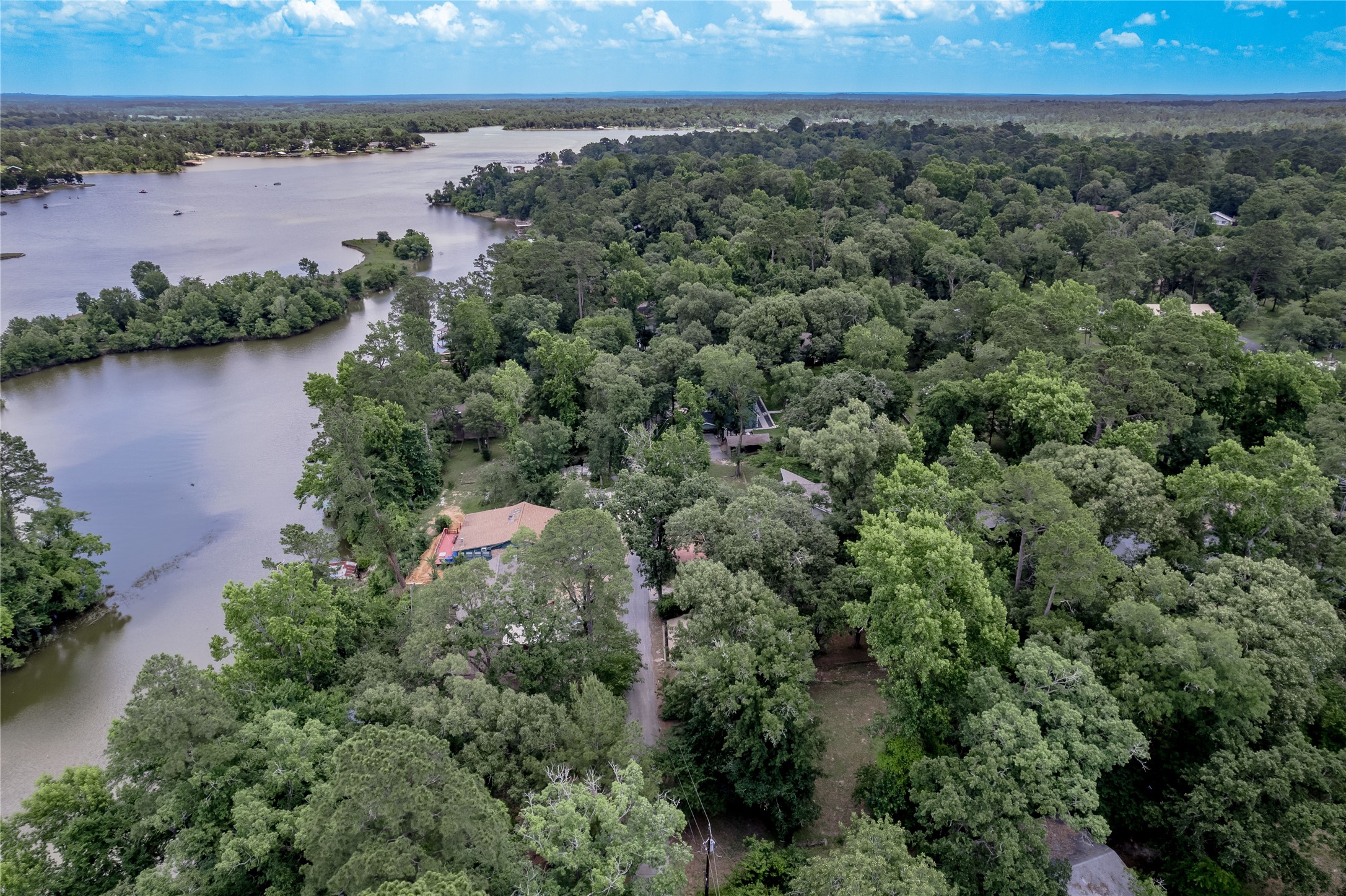 109 Hill Top Road Huntsville, TX 77320 - Photo 31 of 38 an aerial view of a houses with a lake view