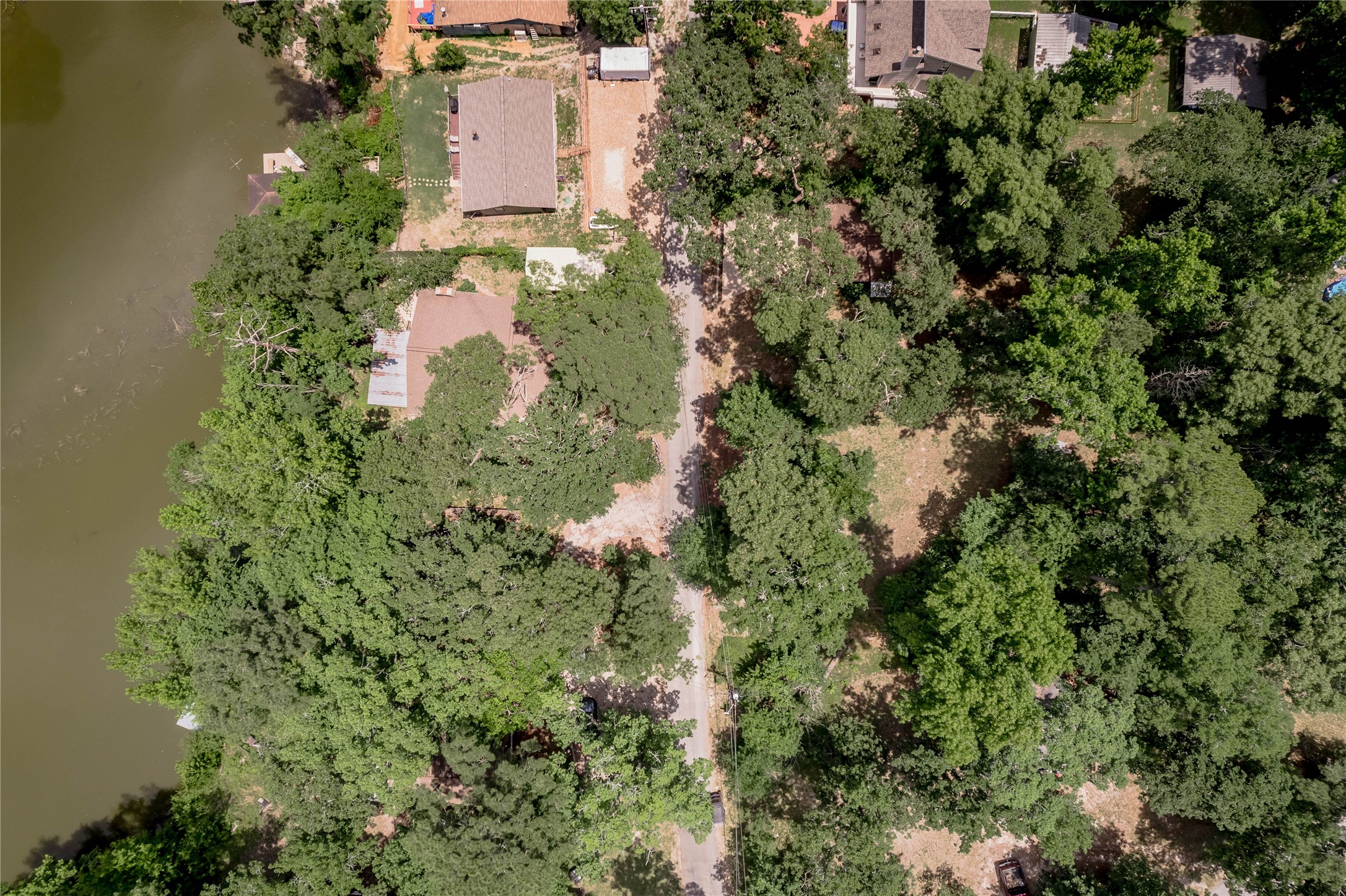 109 Hill Top Road Huntsville, TX 77320 - Photo 35 of 38 an aerial view of residential house with outdoor space and trees all around