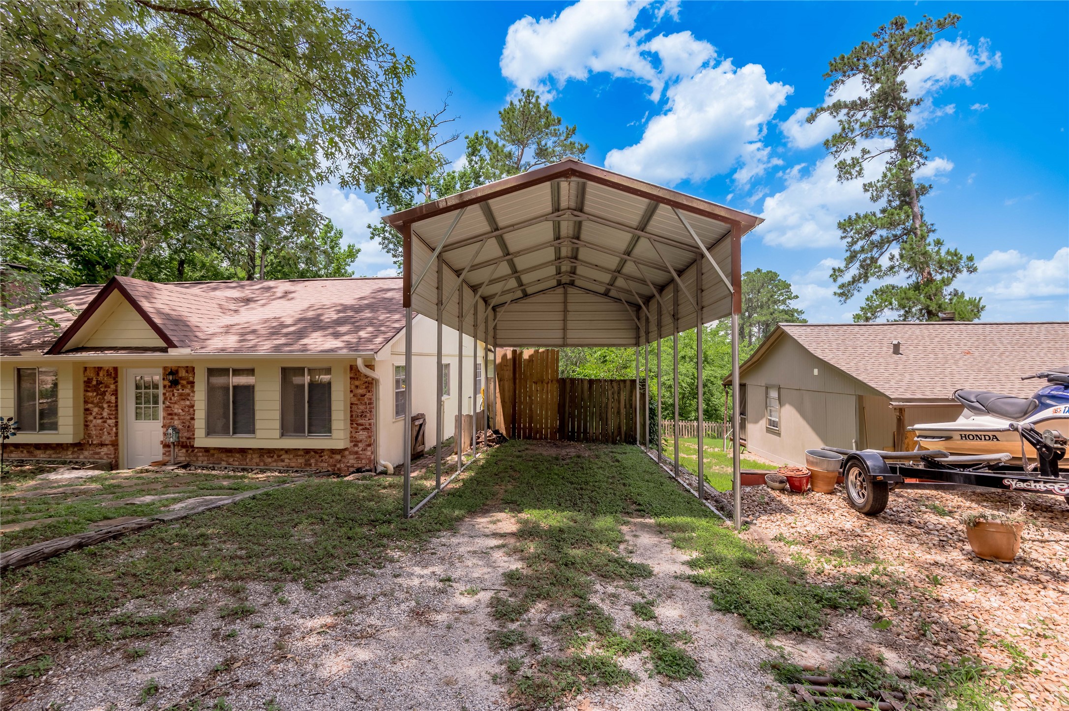 109 Hill Top Road Huntsville, TX 77320 - Photo 7 of 38 a view of a house with a yard