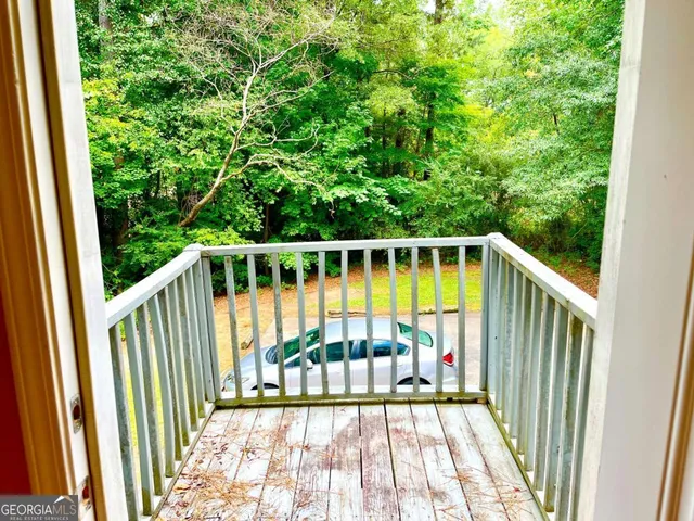 a view of balcony with wooden floor