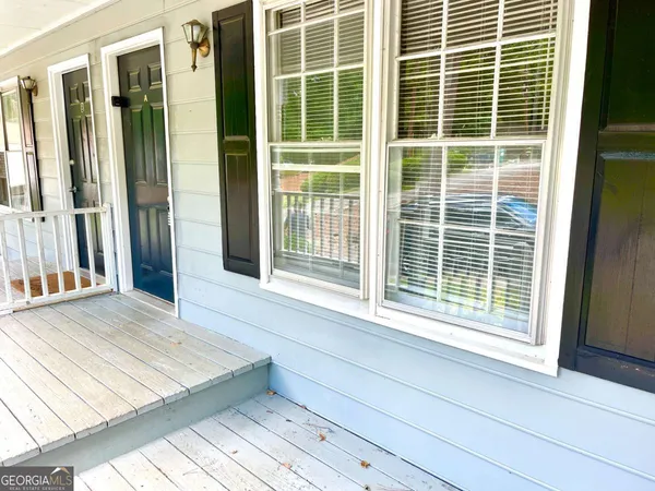 a view of a door and a window