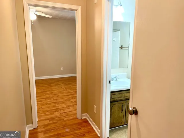 a view of a bathroom from a hallway