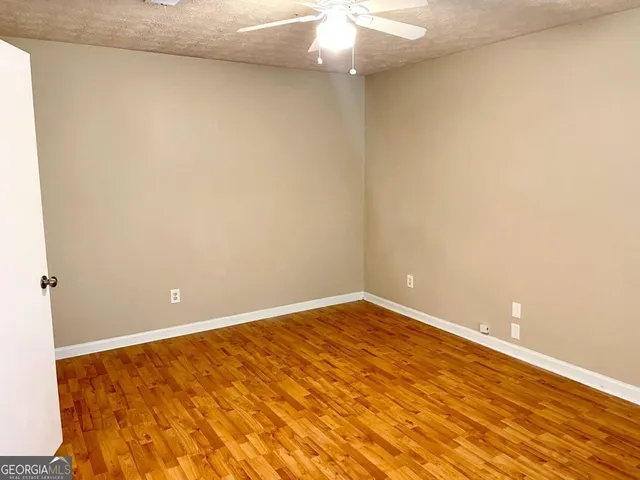 a view of an empty room with a chandelier