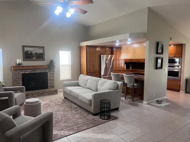 a living room with furniture and a fireplace