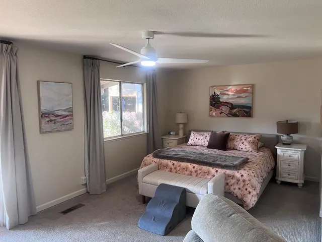 a bedroom with bed and window