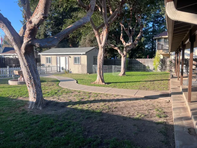 a view of a house with a yard
