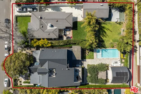 an aerial view of a house with outdoor space